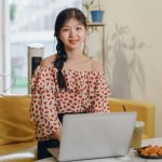 Beautiful Asian girl working at home